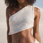 Ivory sequin one-shoulder crop top and maxi skirt set worn on coastal rocks at sunset — Label Loft London | Endless UAE
