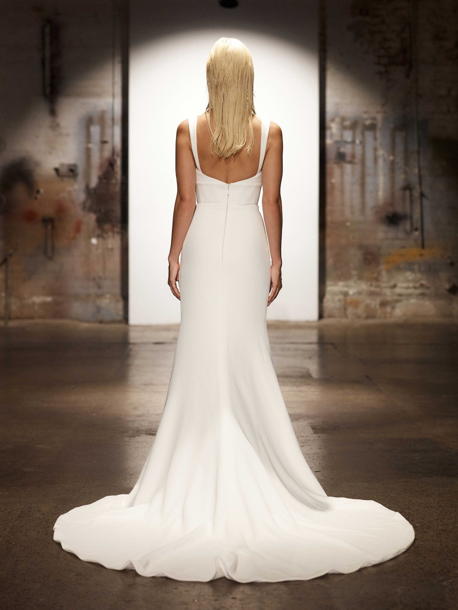 Minimalist ivory crepe mermaid wedding dress with square neckline and cathedral train, back view — You&I Bridal | Endless UAE