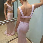 Elegant pink high-waisted maxi skirt with matching crop top set, featuring floor-length silhouette and backless design — By Keara | Endless UAE