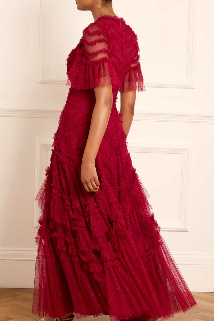 Elegant red evening gown with sheer short sleeves, tiered tulle ruffles, and delicate embellishments in a flowing A-line silhouette — Needle & Thread | Endless UAE