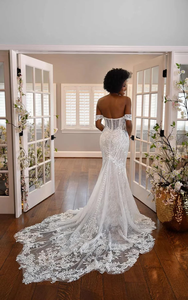 Bride wearing off-the-shoulder lace fit-and-flare wedding dress with cathedral train and intricate beading — Essense of Australia | Endless UAE