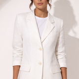 Woman wearing white linen blazer and trousers with white sandals — & Other Stories | Endless UAE