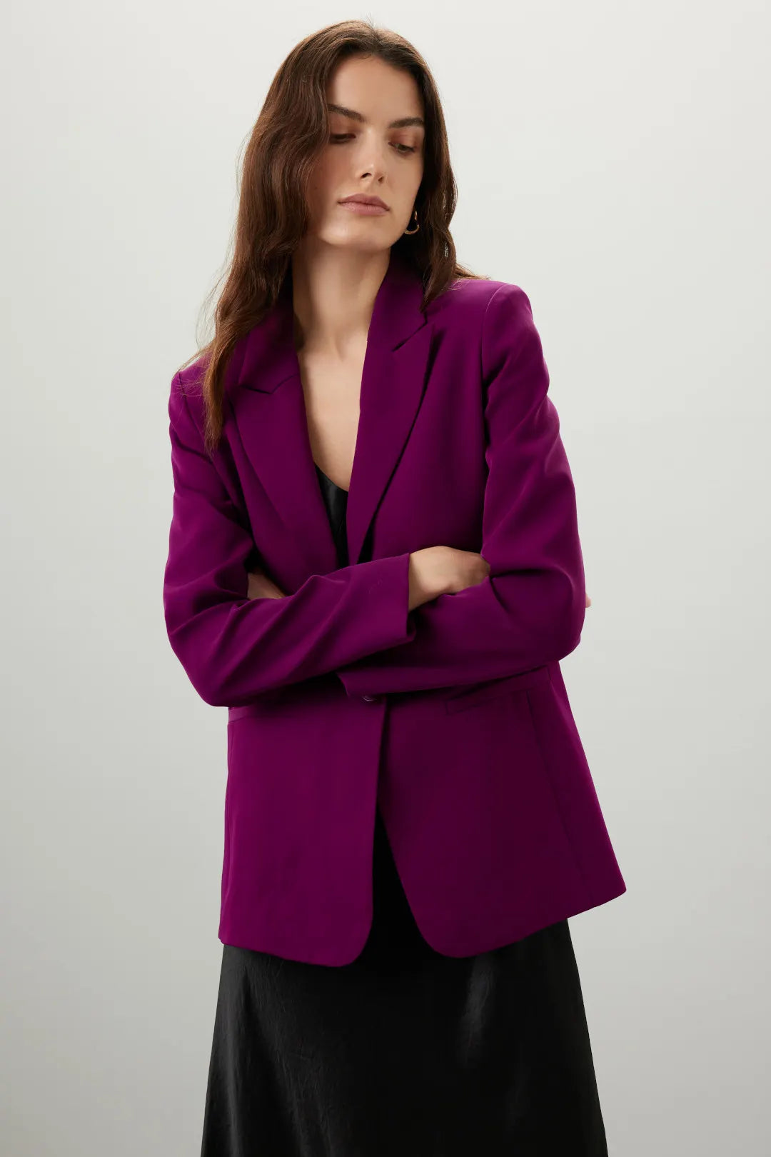 Woman wearing a vibrant purple single breasted blazer with black outfit against neutral background — Endless Rose | Endless UAE