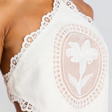 White lace halter crop top and mini skirt set with cutout details — Retrofete | Endless UAE