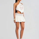 White lace halter crop top and mini skirt set with cutout details — Retrofete | Endless UAE