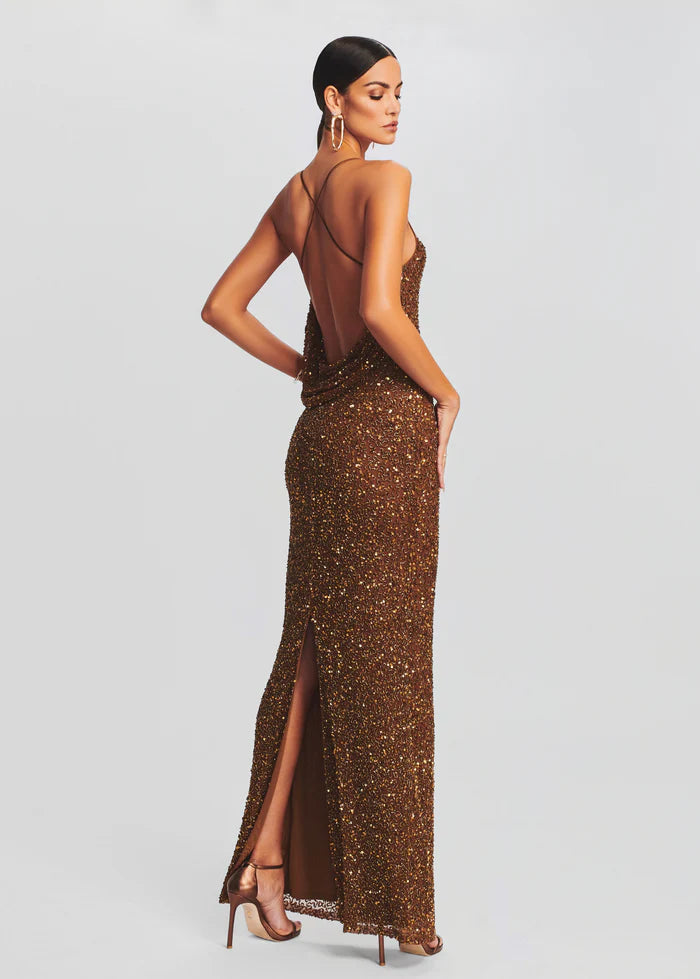 Long bronze sequin evening gown with open back and high slit, model wearing gold heels — Retrofete | Endless UAE