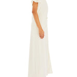 Woman wearing cream Tropez Maxi Dress with side slit, straw bag and strappy heels — SER.O.YA | Endless UAE