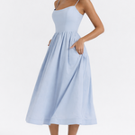 Woman wearing light blue sleeveless midi dress with corset top and full skirt — Endless | Endless UAE
