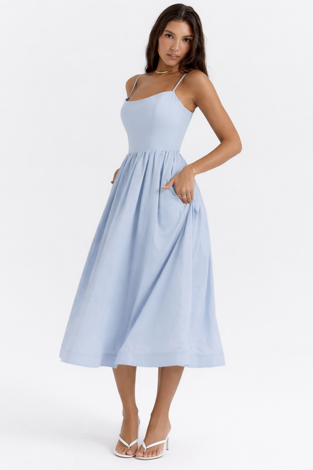 Woman wearing light blue sleeveless midi dress with corset top and full skirt — Endless | Endless UAE