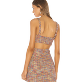 Multicolored tweed crop top with thick straps and back cutout detail, worn with matching skirt — Song of Style | Endless UAE