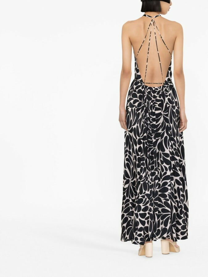 Black and white floral halter jumpsuit with deep V-neckline and wide-leg silhouette — Alexandra Miro | Endless UAE