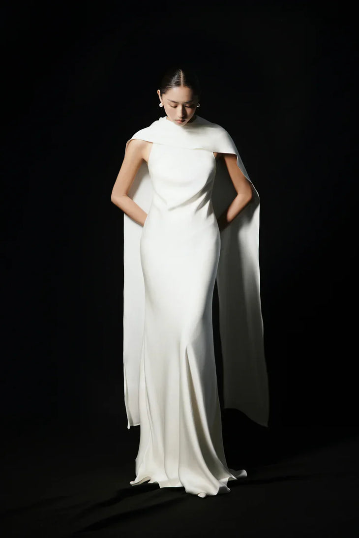 Venus Silk Dress in ivory with dramatic cape detailing, flowing silhouette — Huong Boutique | Endless UAE