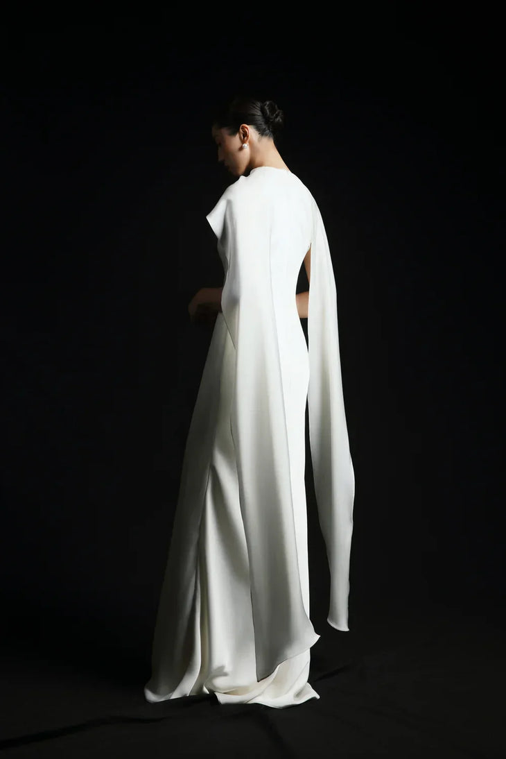 Venus Silk Dress in ivory with dramatic cape detailing, flowing silhouette — Huong Boutique | Endless UAE