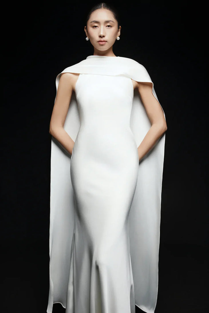 Venus Silk Dress in ivory with dramatic cape detailing, flowing silhouette — Huong Boutique | Endless UAE