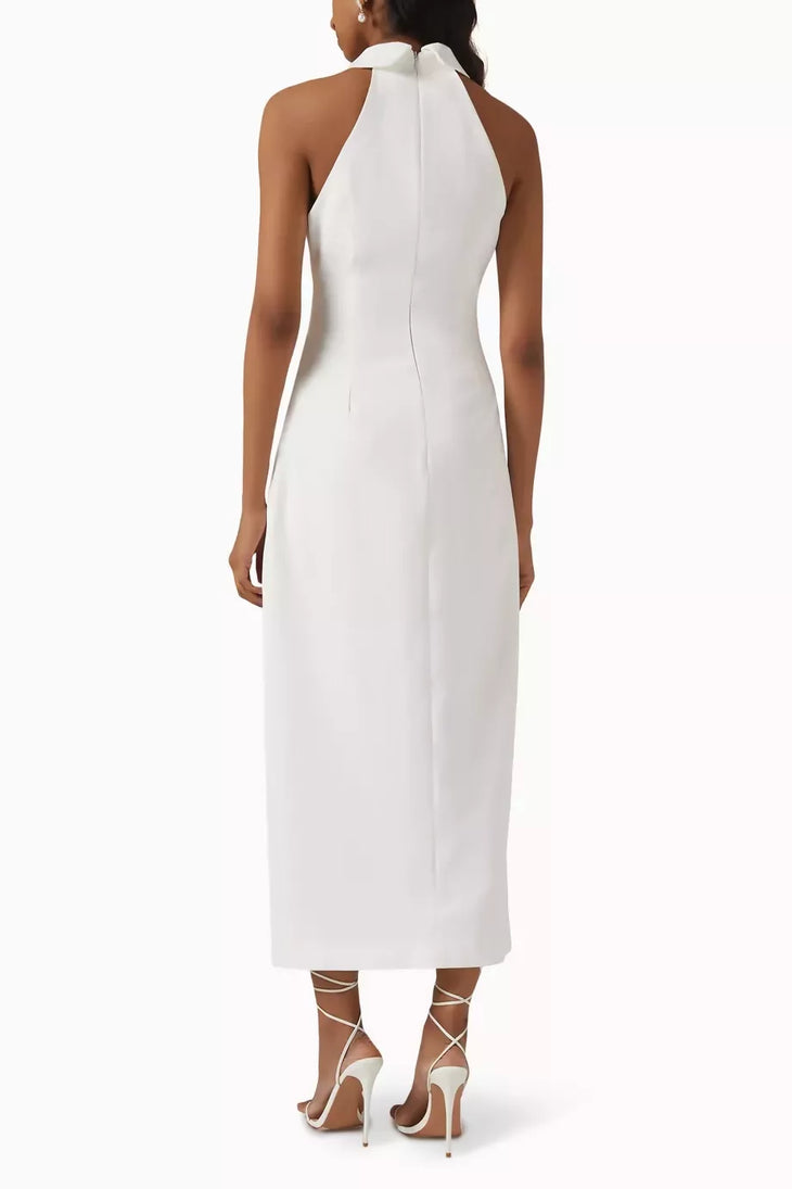 Woman wearing white sleeveless halter maxi dress with front slit and white strappy heels — Odd Muse | Endless UAE