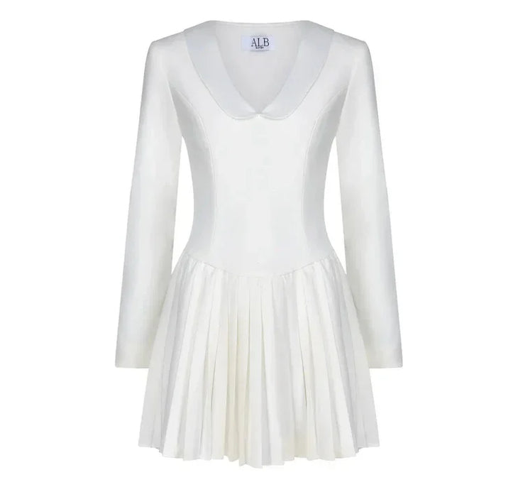 The Mayfair Dress in cream features a collared neckline and pleated skirt — Anne Louise Boutique | Endless UAE