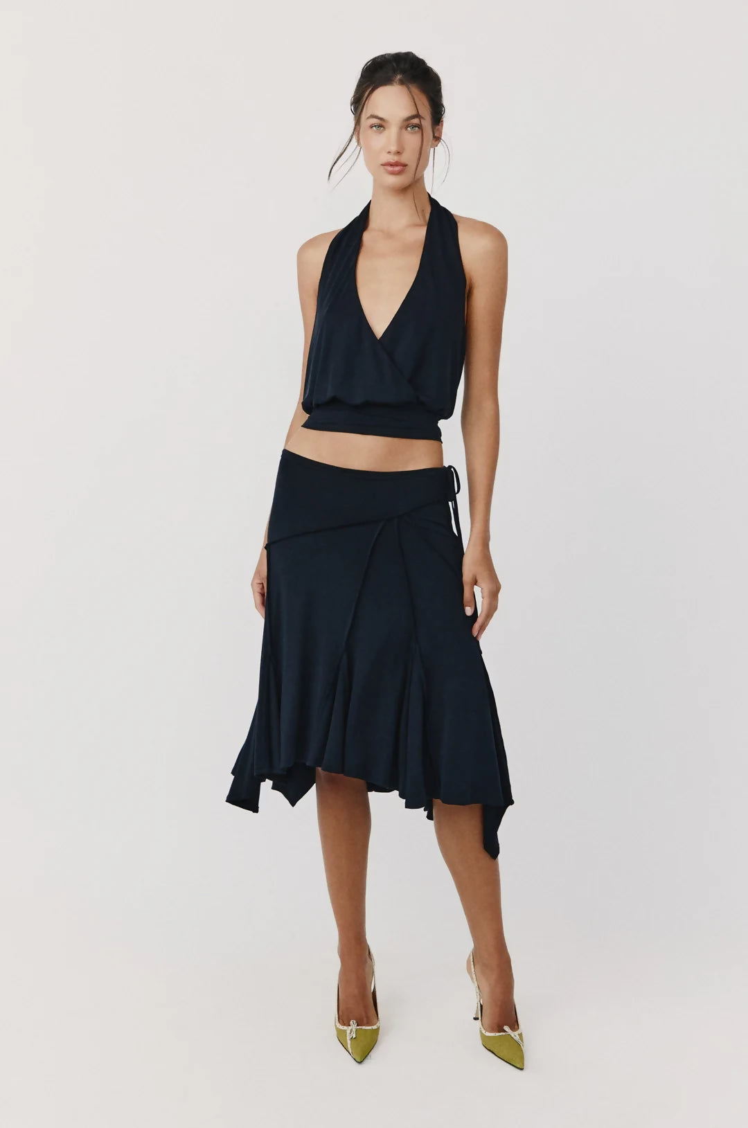 Black halter top and asymmetric skirt two-piece set with wrap details and flared hem — With Jean | Endless UAE