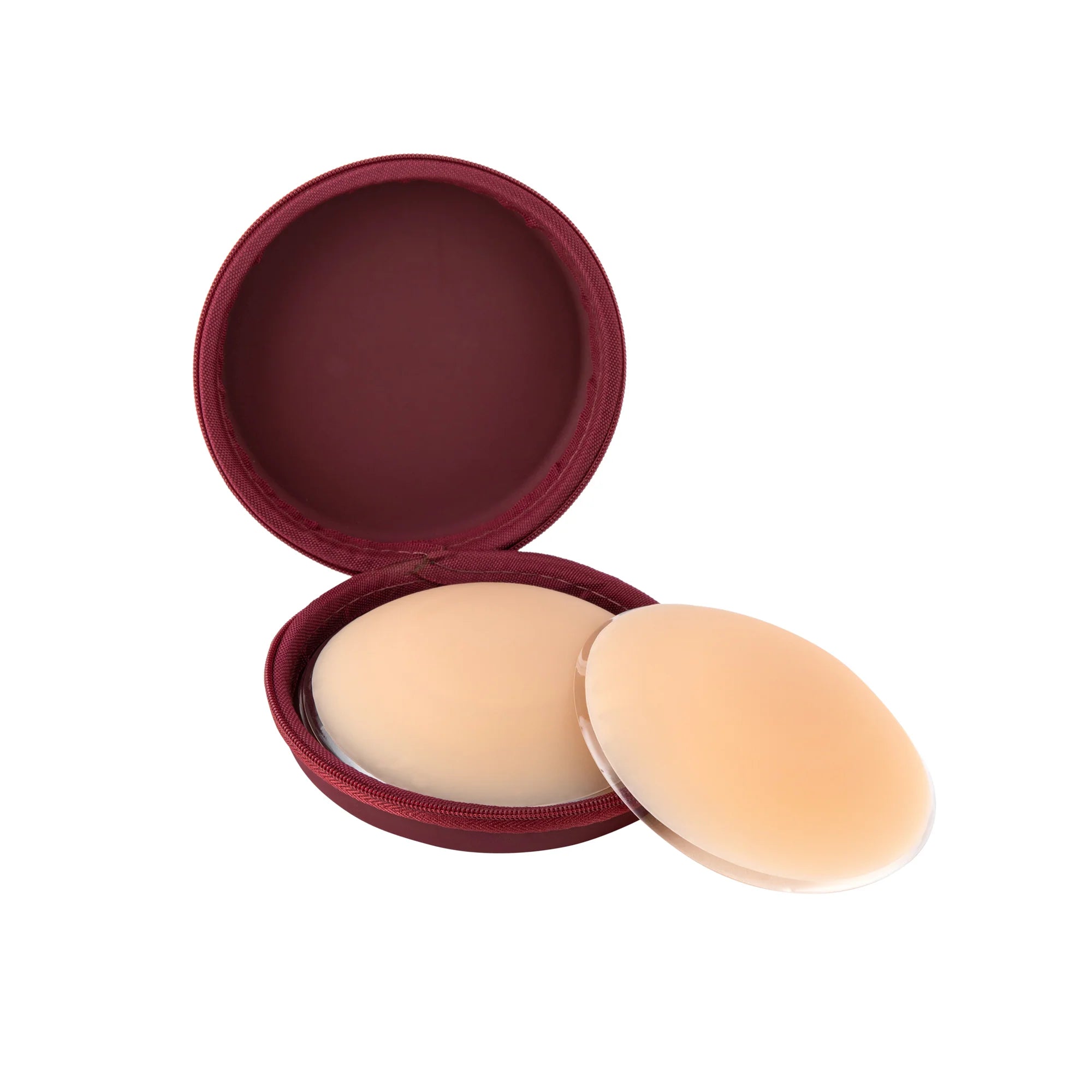 Beige silicone nipple covers with burgundy round storage case on white background — Talaa | Endless UAE