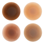 Four round silicone nipple covers in varying skin tone shades arranged in a grid — Talaa | Endless UAE