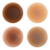 Four round silicone nipple covers in varying skin tone shades arranged in a grid — Talaa | Endless UAE