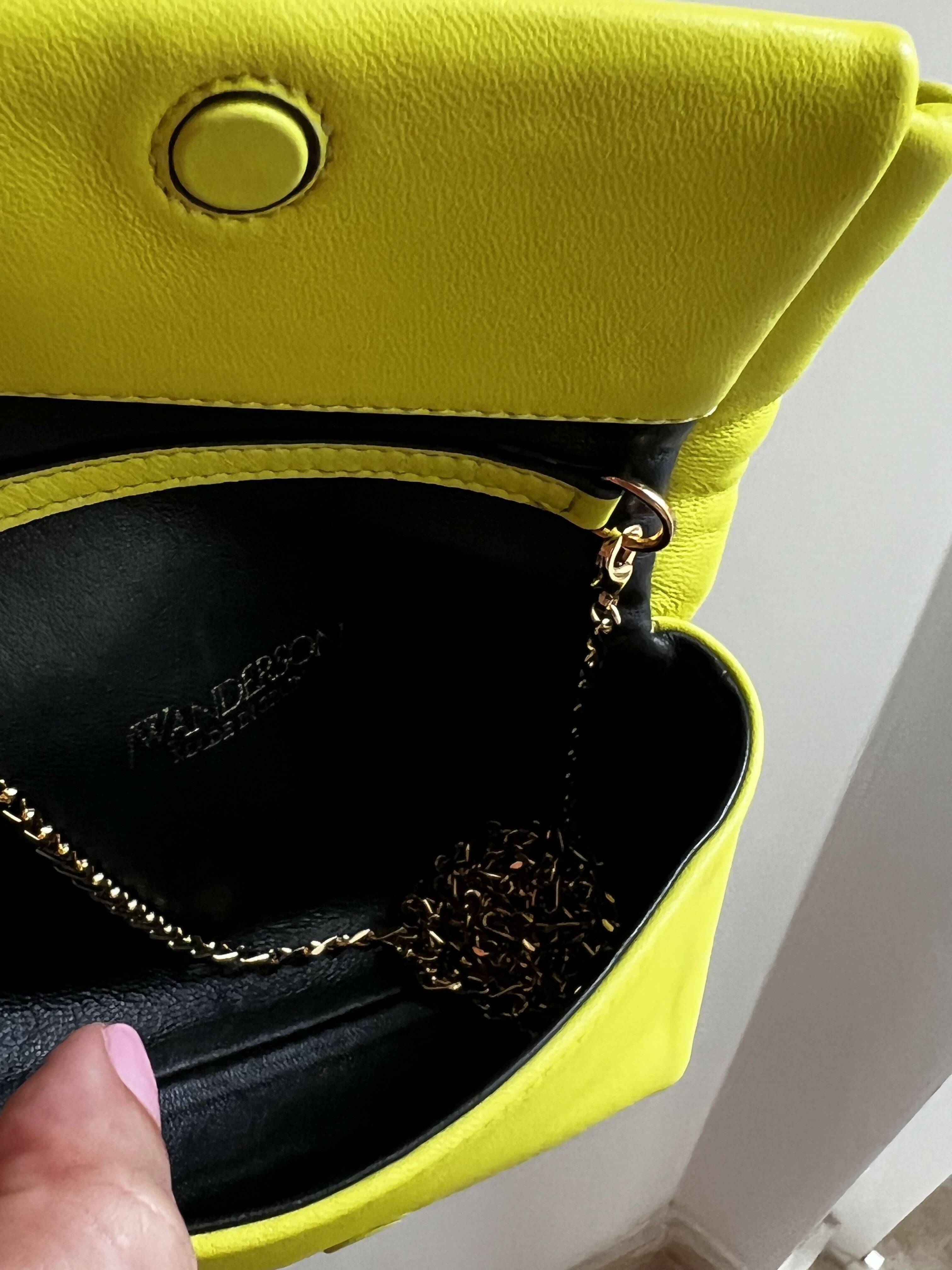 Bright yellow Twister Nano crossbody bag with black leather interior and gold chain strap detail — JW Anderson | Endless UAE