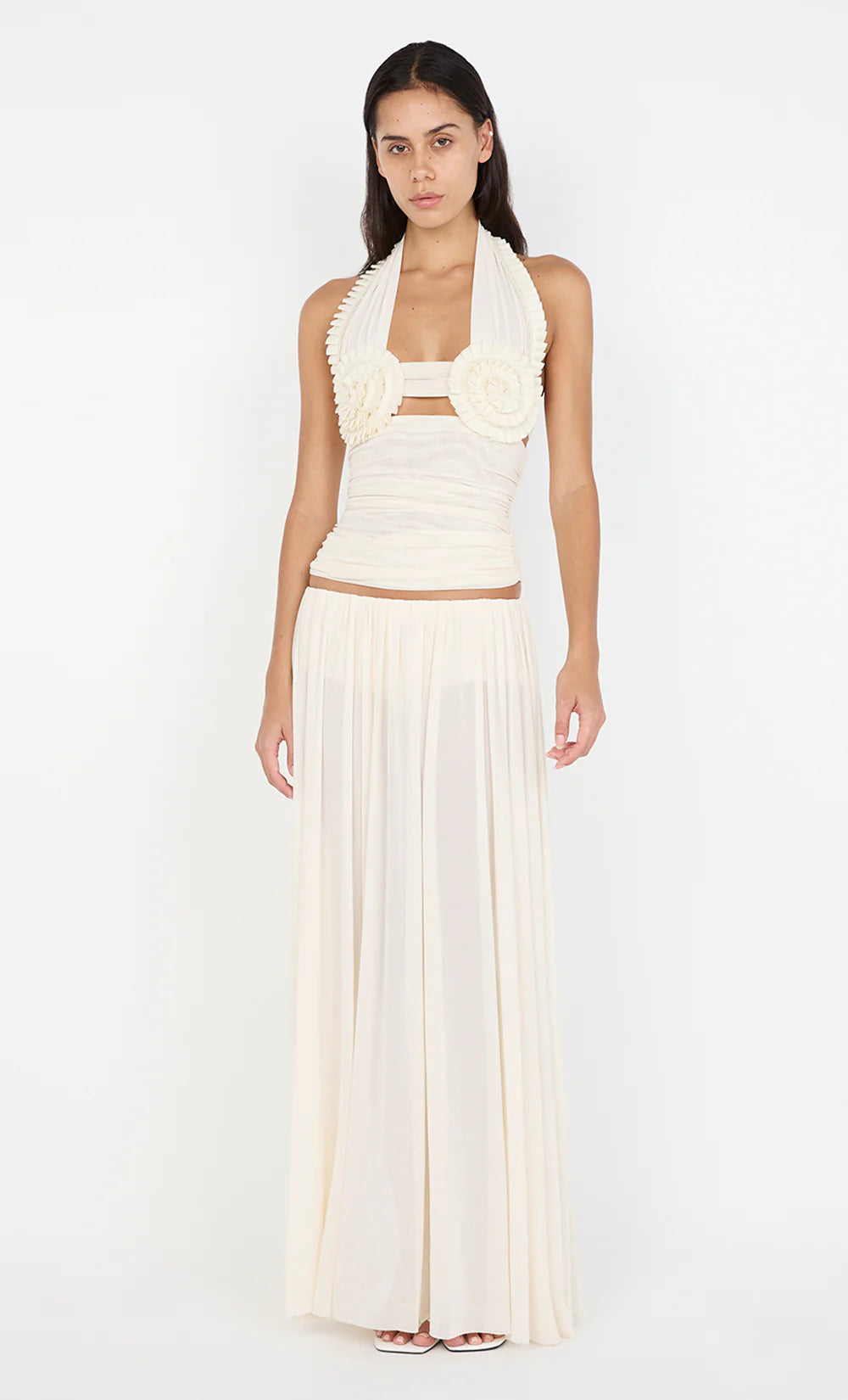Elegant cream halter top with rosette detail and matching pleated maxi skirt co-ord set — Bec + Bridge | Endless UAE