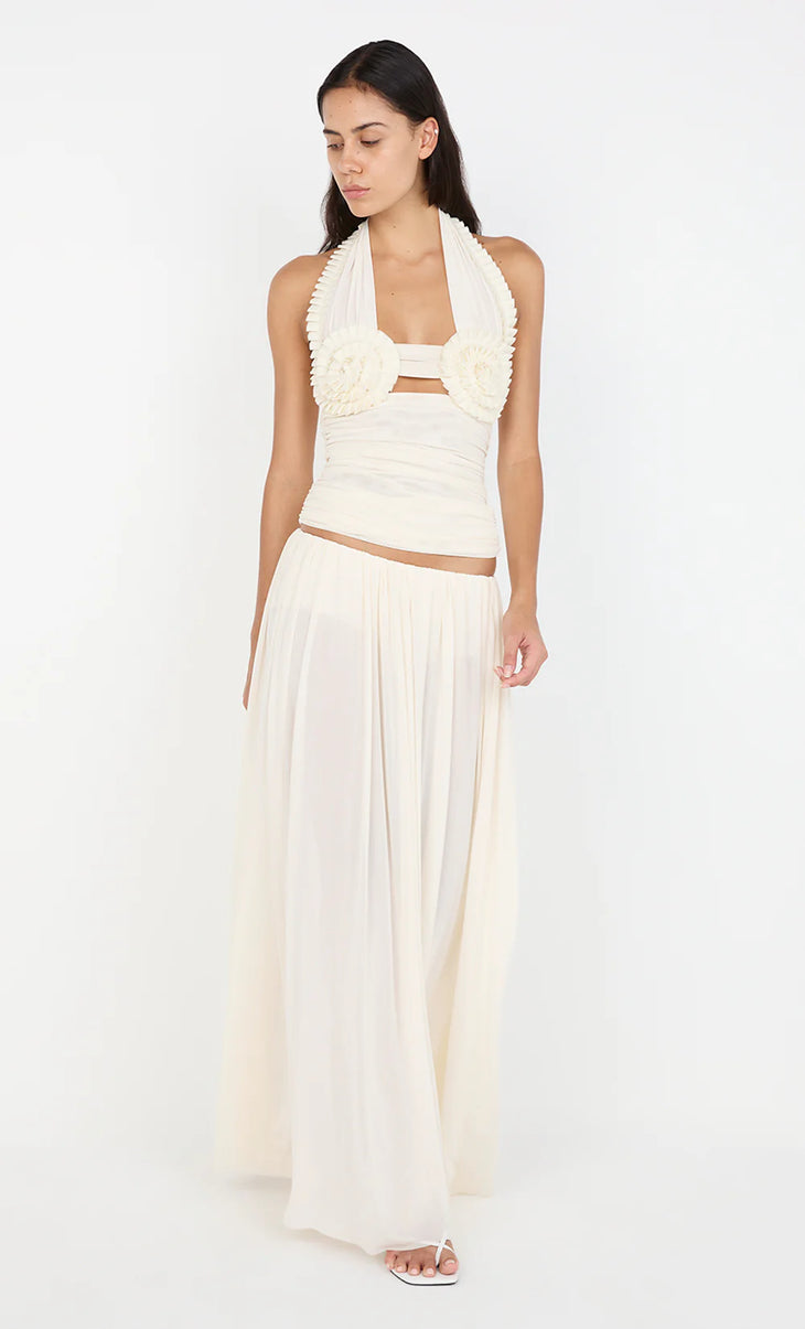 Elegant cream co-ord set with pleated halter top featuring rosette detail and flowing maxi skirt — Bec + Bridge | Endless UAE