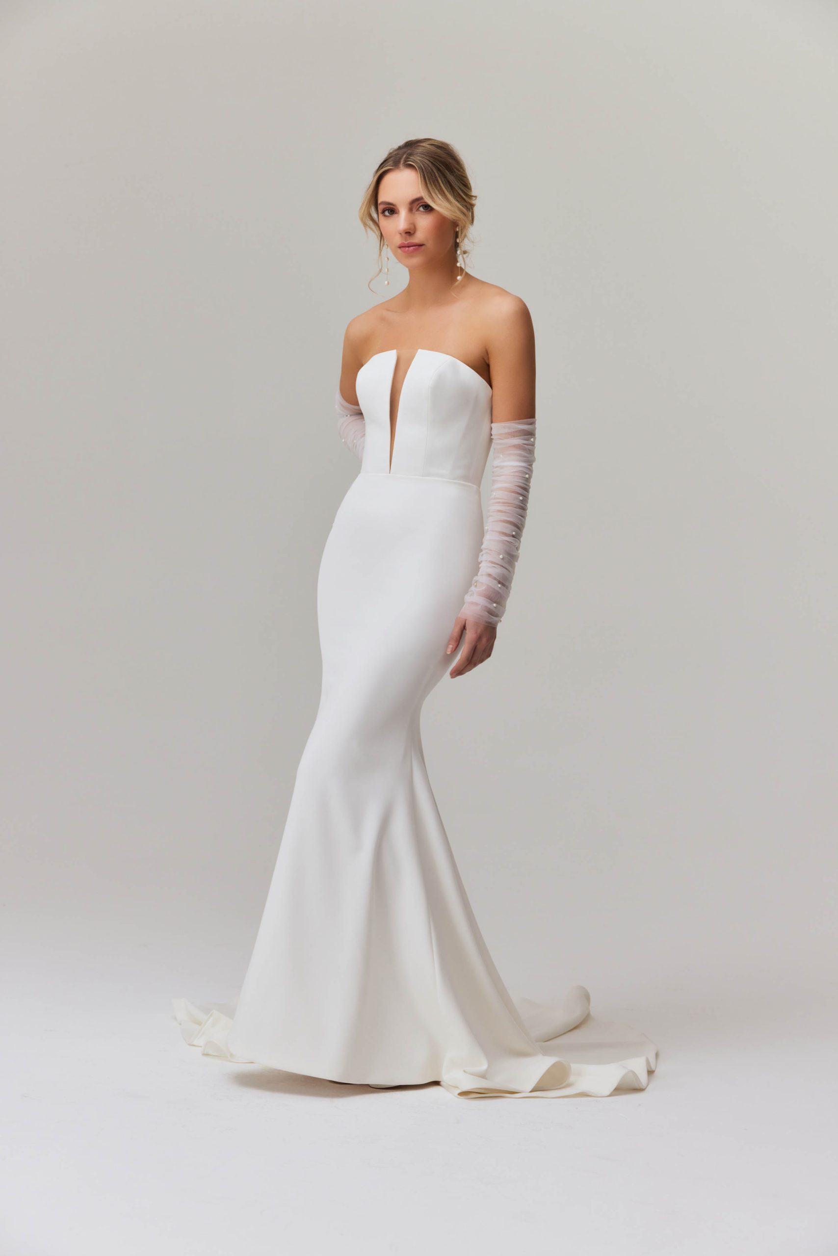 Elegant strapless mermaid wedding dress with plunging neckline and sheer tulle sleeves — You&I Bridal | Endless UAE