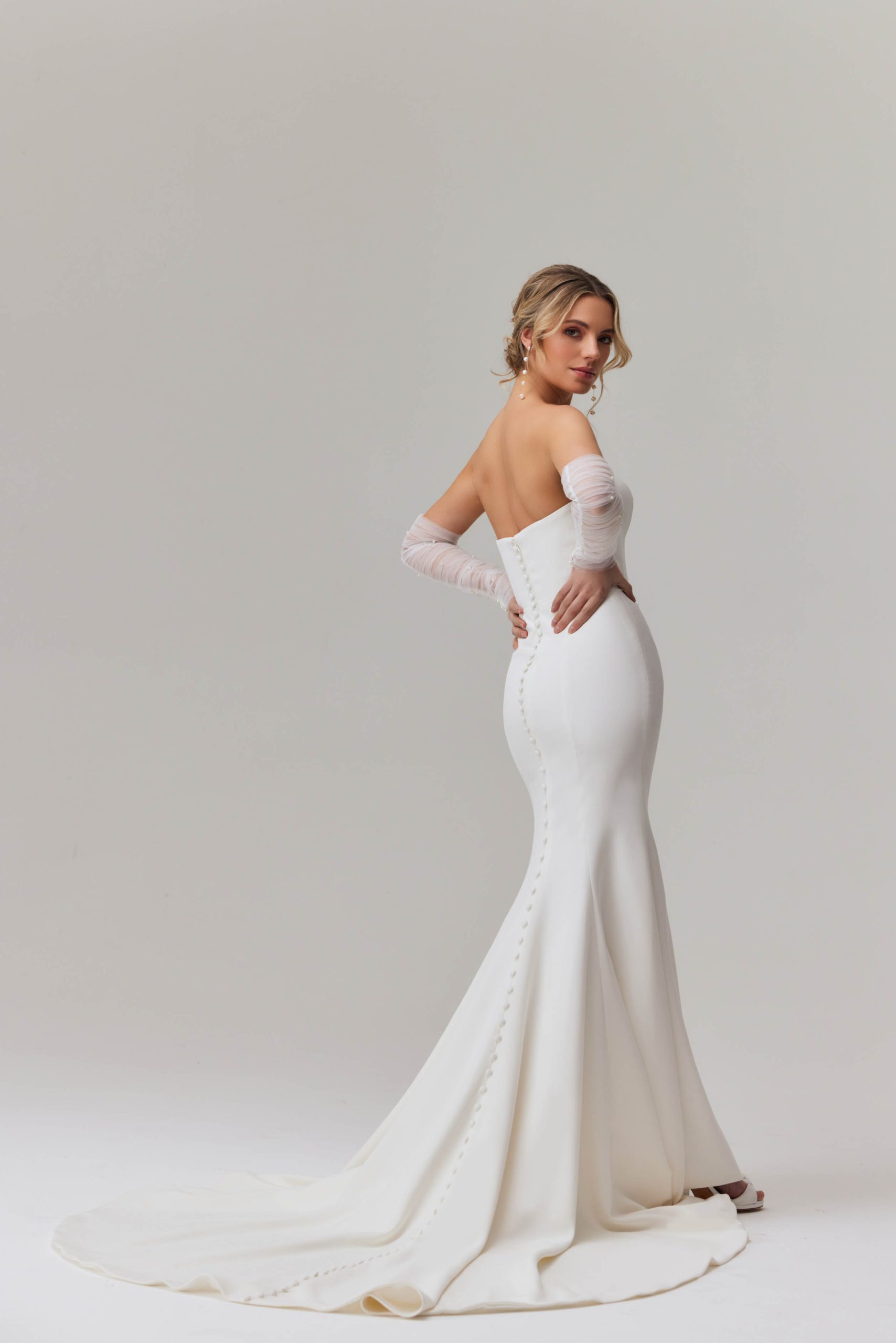 Elegant strapless mermaid wedding dress with plunging neckline and sheer tulle sleeves — You&I Bridal | Endless UAE