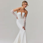 Elegant strapless mermaid wedding dress with plunging neckline and sheer tulle sleeves — You&I Bridal | Endless UAE