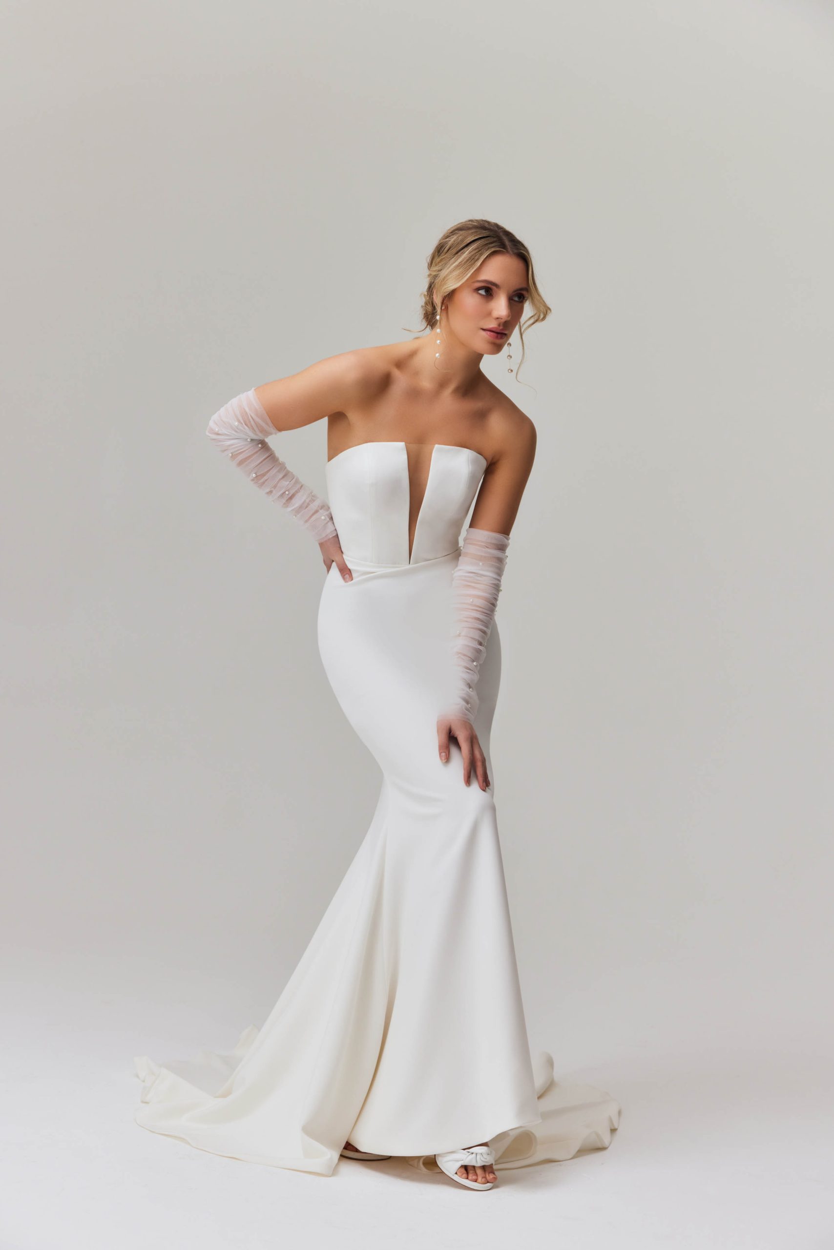 Elegant strapless mermaid wedding dress with plunging neckline and sheer tulle sleeves — You&I Bridal | Endless UAE