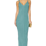 Woman wearing teal ribbed sleeveless maxi dress with V-neckline — Hervé Léger | Endless UAE