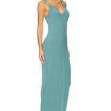Woman wearing teal ribbed sleeveless maxi dress with V-neckline — Hervé Léger | Endless UAE