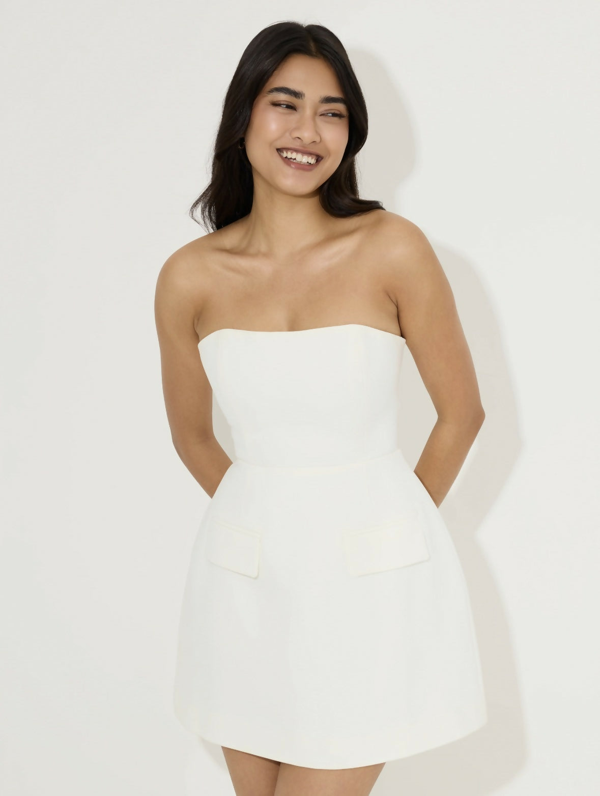 Women's white strapless mini dress with peplum waist detail and structured silhouette — Odd Muse | Endless UAE