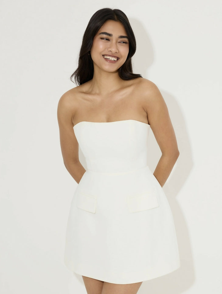 Women's white strapless mini dress with peplum waist detail and structured silhouette — Odd Muse | Endless UAE