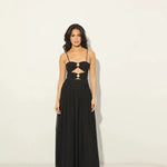 Woman wearing black Legacy Maxi Dress with cutout details and flowing skirt — Anne Louise Boutique | Endless UAE