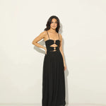 Woman wearing black Legacy Maxi Dress with cutout details and flowing skirt — Anne Louise Boutique | Endless UAE