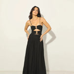 Woman wearing black Legacy Maxi Dress with cutout details and flowing skirt — Anne Louise Boutique | Endless UAE