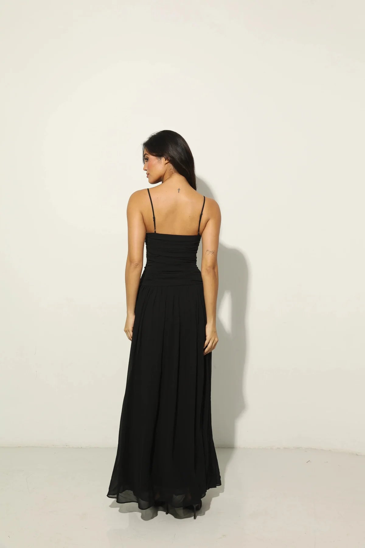 Woman wearing black Legacy Maxi Dress with cutout details and flowing skirt — Anne Louise Boutique | Endless UAE