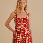 Woman wearing red and cream sleeveless romper with geometric pattern — Farm Rio | Endless UAE