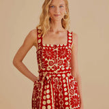 Woman wearing red and cream sleeveless romper with geometric pattern — Farm Rio | Endless UAE