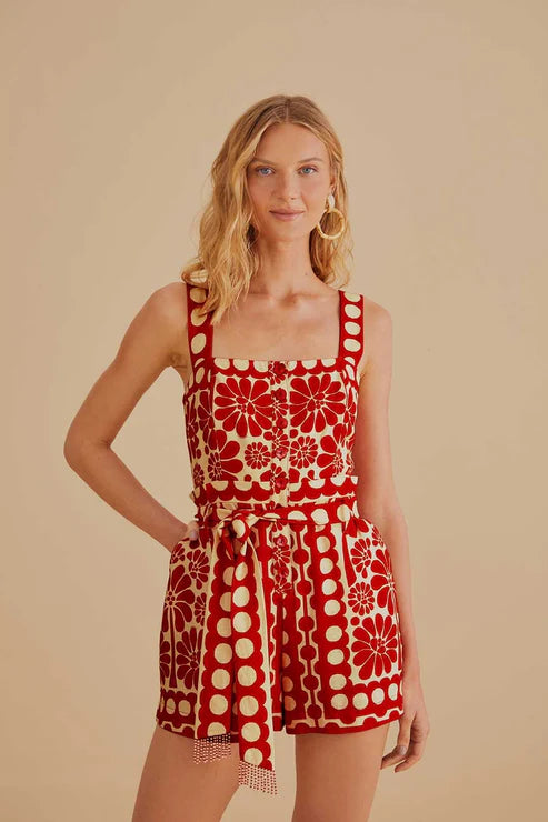 Woman wearing red and cream sleeveless romper with geometric pattern — Farm Rio | Endless UAE