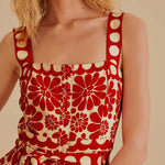 Woman wearing red and cream sleeveless romper with geometric pattern — Farm Rio | Endless UAE