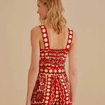 Woman wearing red and cream sleeveless romper with geometric pattern — Farm Rio | Endless UAE