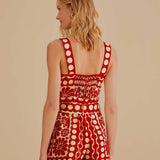 Woman wearing red and cream sleeveless romper with geometric pattern — Farm Rio | Endless UAE