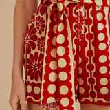 Woman wearing red and cream sleeveless romper with geometric pattern — Farm Rio | Endless UAE