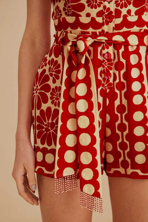 Woman wearing red and cream sleeveless romper with geometric pattern — Farm Rio | Endless UAE