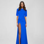 Woman wearing blue Raya Maxi Dress with half sleeves and high slit — ATOIR | Endless UAE