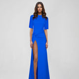 Woman wearing blue Raya Maxi Dress with half sleeves and high slit — ATOIR | Endless UAE