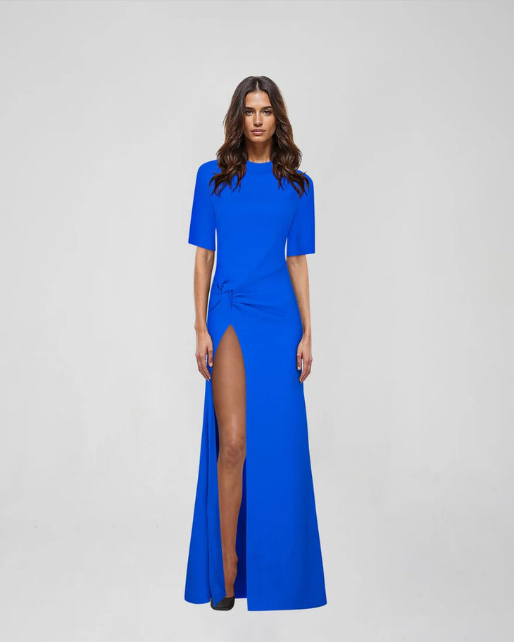 Woman wearing blue Raya Maxi Dress with half sleeves and high slit — ATOIR | Endless UAE